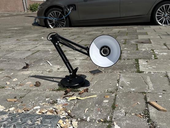 lamp impersonating the pixar character put out with the trash