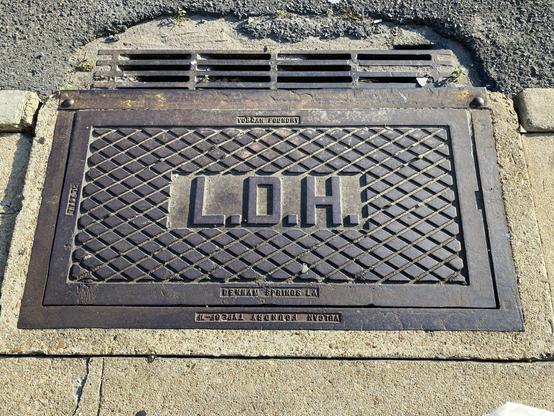 Rectangular drain cover with the big letters "L.D.H." and the smaller inscription "Vulcan Foundry, Denham Springs, LA"