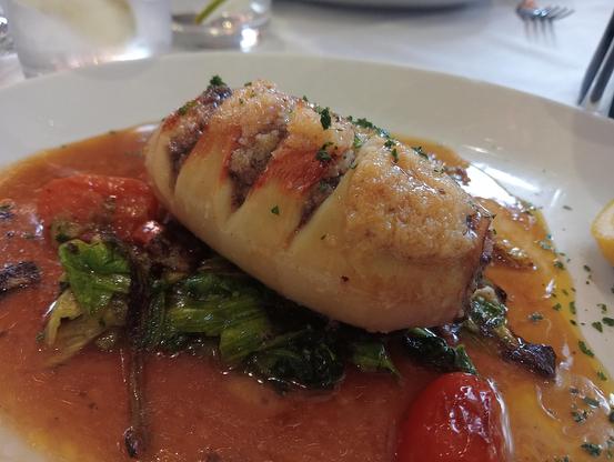 Calamari Ripienne - squid stuffed with black pudding and chorizo on a bed of spinache and garlic