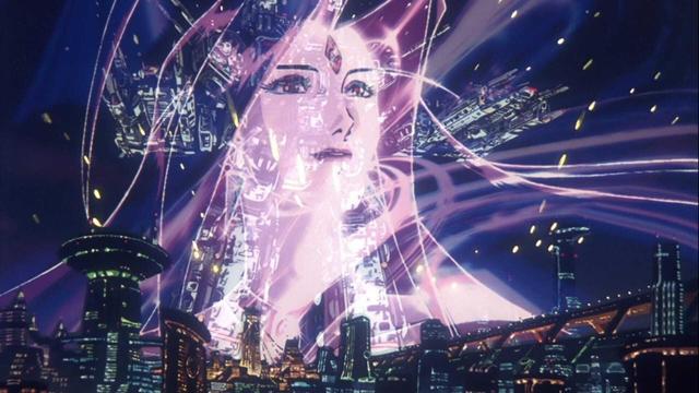 Screenshot from Macross Plus that depicts a massive image of Sharon Apple, a virtual idol with flowing purple hair, projected over the Super Dimension Fortress Macross
