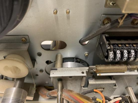 Melted capstan belt around the motor shaft.