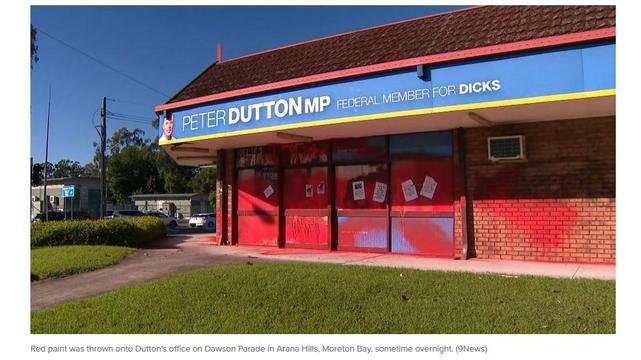 Image shows the outside of Duttons office covered in red paint