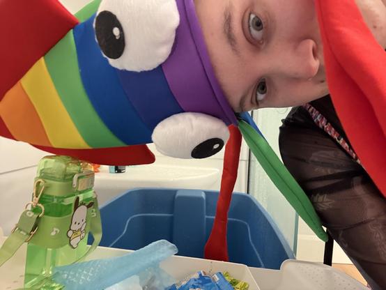 Yes I’m wearing a squid hat with a hair cap for aesthetics and have a snack tray for tub time
