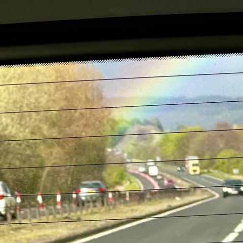 Rainbow seen from a car through the back windshield