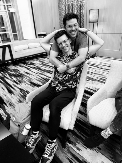 Adrian and Kyle exchanging a lovely hug