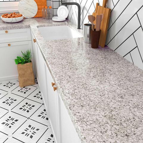Luxurious kitchen island in Dubai made with premium granite, blending strength with modern design.