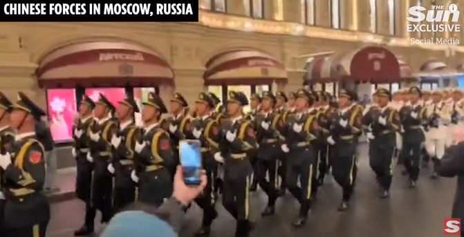 Communist China's soldiers marching in moscow, showinf it's strength over russia, passing outside Detskiy Gym (Children's Gymnastics Center, moscow)

(Image: screenshot from Sun)