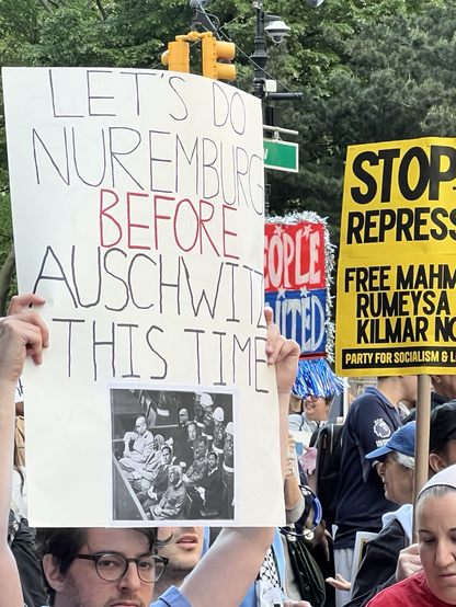the poster has a pic of the famous accused box, but with the superimposed faces of Stephen Miller, Pam Bondi, Marco Rubio, Donald Trump, JD Vance, Elon Musk and 2 other i cannot recognize