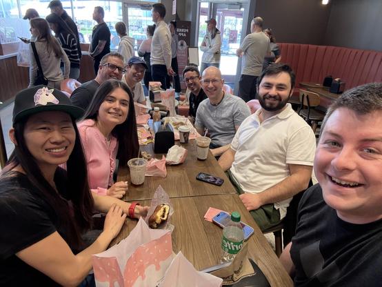 Group of incredible engineers having donuts and coffee