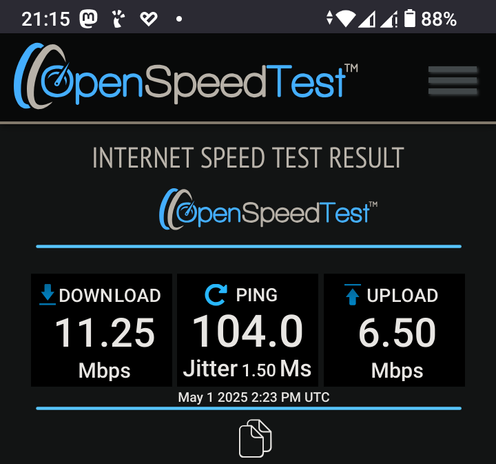 The screencap displays a screenshot of the OpenSpeedTest app on a mobile device. The top section of the screen shows the app's logo, "OpenSpeedTest," with a stylized speedometer icon. Below the logo, the text "INTERNET SPEED TEST RESULT" is prominently displayed. The main section of the screen presents the test results, with three distinct boxes: the left box shows "DOWNLOAD 11.25 Mbps," the middle box indicates "PING 104.0 Jitter 1.50 Ms," and the right box displays "UPLOAD 6.50 Mbps." The date and time of the test, "May 1 2025 2:23 PM UTC," are shown at the bottom. The background of the screen is dark, with blue and white text and icons, providing a clear contrast for readability. The status bar at the top of the screen shows the time as 21:15, the battery level at 88%, and various connectivity icons, including Wi-Fi and cellular signal strength.

 Ovis2-8B

🌱 Energy used: 0.226 Wh