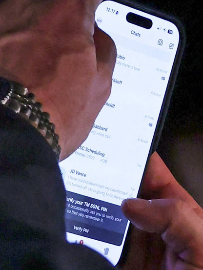 This is a photo of Mike Waltz's phone. In a room full of cameras, with his brightness all the way up, he can't wait until the end of a meeting to check his Signal. Not even a privacy screen protector. You can literally see everyone he's messaging and part of the what they say.