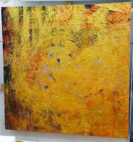 a painting, it is a large mass of dark gold - amber tones swirling against a black and red background 