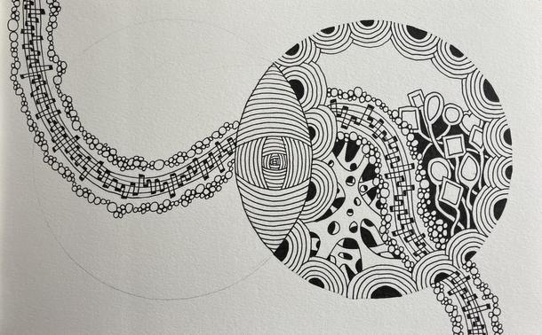 One circle is filling up with patterns and the connecting ribbon has been drawn