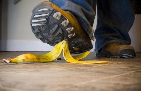 Learning from experience: photograph of a person's foot about to step on a banana peel. Photo attribution: Flickr user markybon
