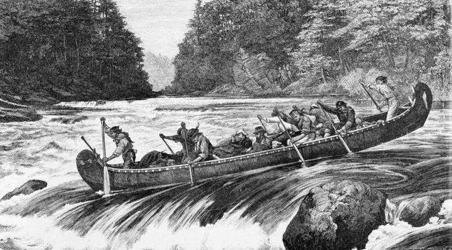 A canoe on a rapid filled Canadian River, with paddlers working hard and the two gentlemen seated in the centre of the canoe. 