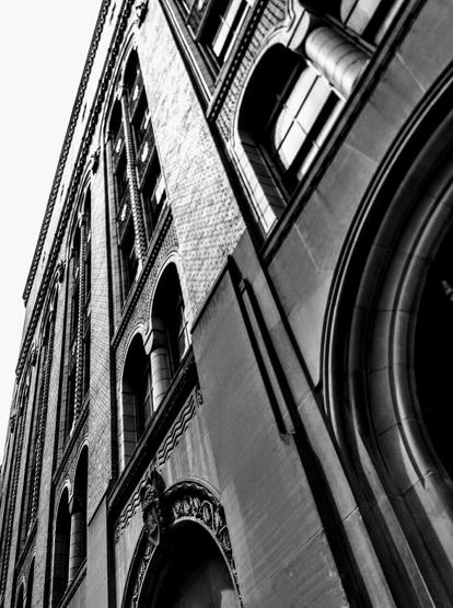 Black and white photo of a brick building in downtown Grand Rapids