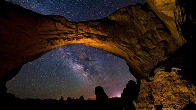 The Milky Way framed by Double Arch in Arches National Park, Utah, United States