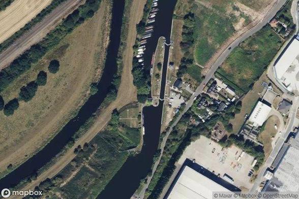A satellite image of the area containing Footbridge over old lock. Provided by MapBox.