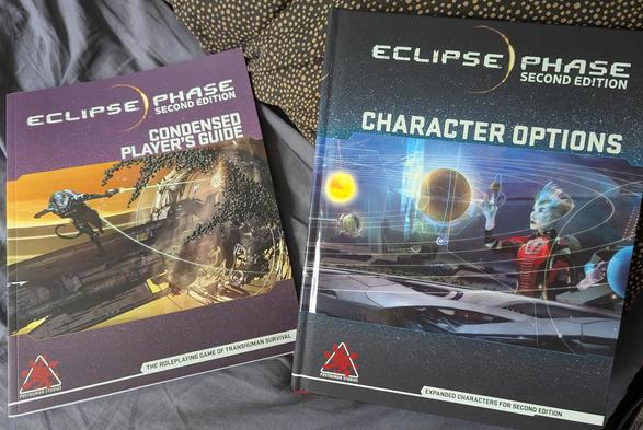 Photo of Eclipse Phase Condensed Player's Guide and Character Options books.