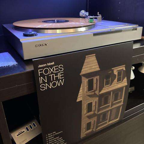 The album is metallic gold vinyl and in the picture is playing on a Sony direct drive turntable. 