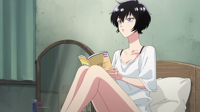 A woman in a large white t-shirt sitting on a bed with a book in her hands.