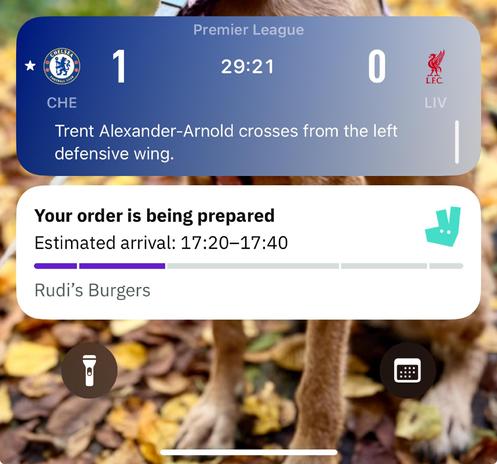 Phone screen notification saying Chelsea are winning and the burgers are on their way. 