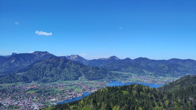 View over mountains and a valley with a blue lake