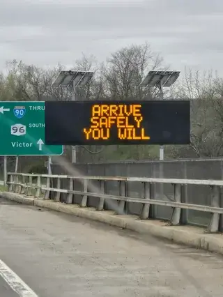 highway sign: arrive safely you will