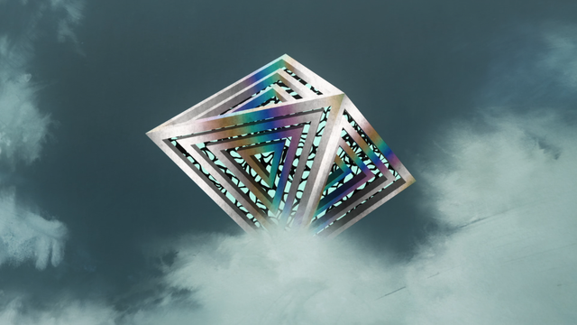 A giant diamond shaped object floating in the sky.