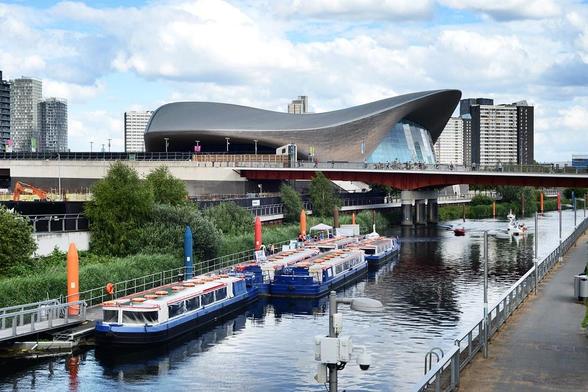 A photo titled "Aquatics Centre across the Waterworks River", taken near Marshgate Lane Bridge by srfurley on Flickr.