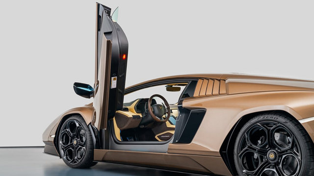 the door  is open, the interior is light tan with black accents 