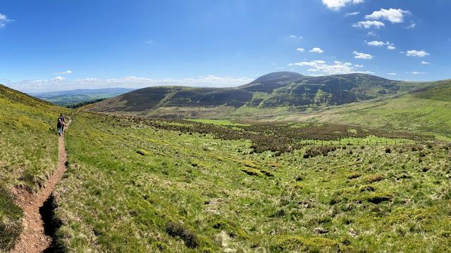 Hiking through otherworldly, marbled hills, wide open space all around 