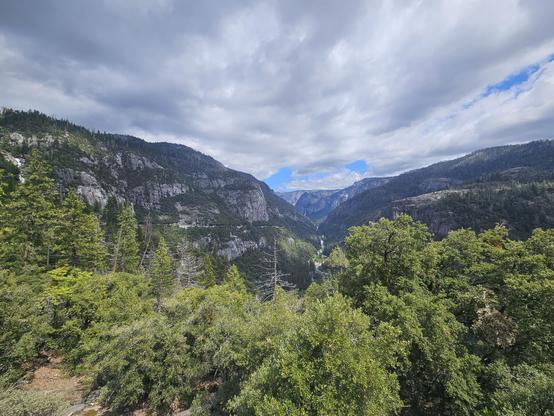 Gorgeous view of mountains in Yosemite National Park. The sky is overcast.