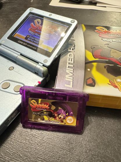 A picture of Shantea Advance with a Gameboy advance so and the games box in the background ground