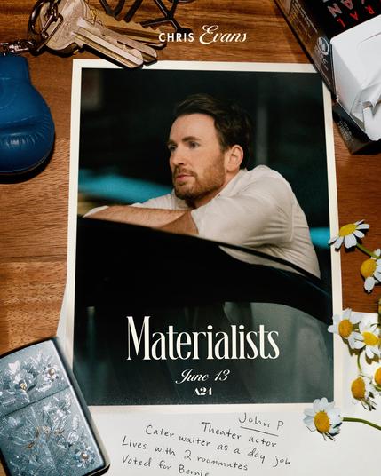 Promo pic for The Materialists which starts June 13th.
We see a picture of Chris Evans as his character in a white shirt behind a black car. He leans against the car and puts his ellbows and arms on the roof. The picture lies on the surface of a wooden table. Next to it lie an engraved silver lighter, keys on a key chain in form of a blue boxing glove, a pack of cigarettes in a black box with red writing on it, some daysies and a piece of paper with handwriting on it saying: "John P.: Theatre actor. Cater waiter as a day job. Lives with 2 roommates. Voted for Bernie."