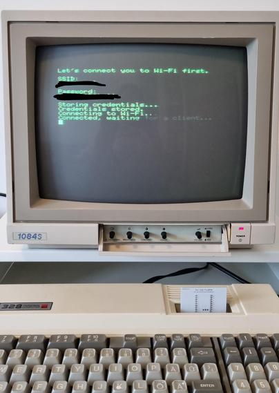 Old Spectravideo computer and a CRT monitor showing program output