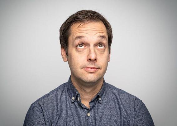 Photo of someone looking up at the text above him