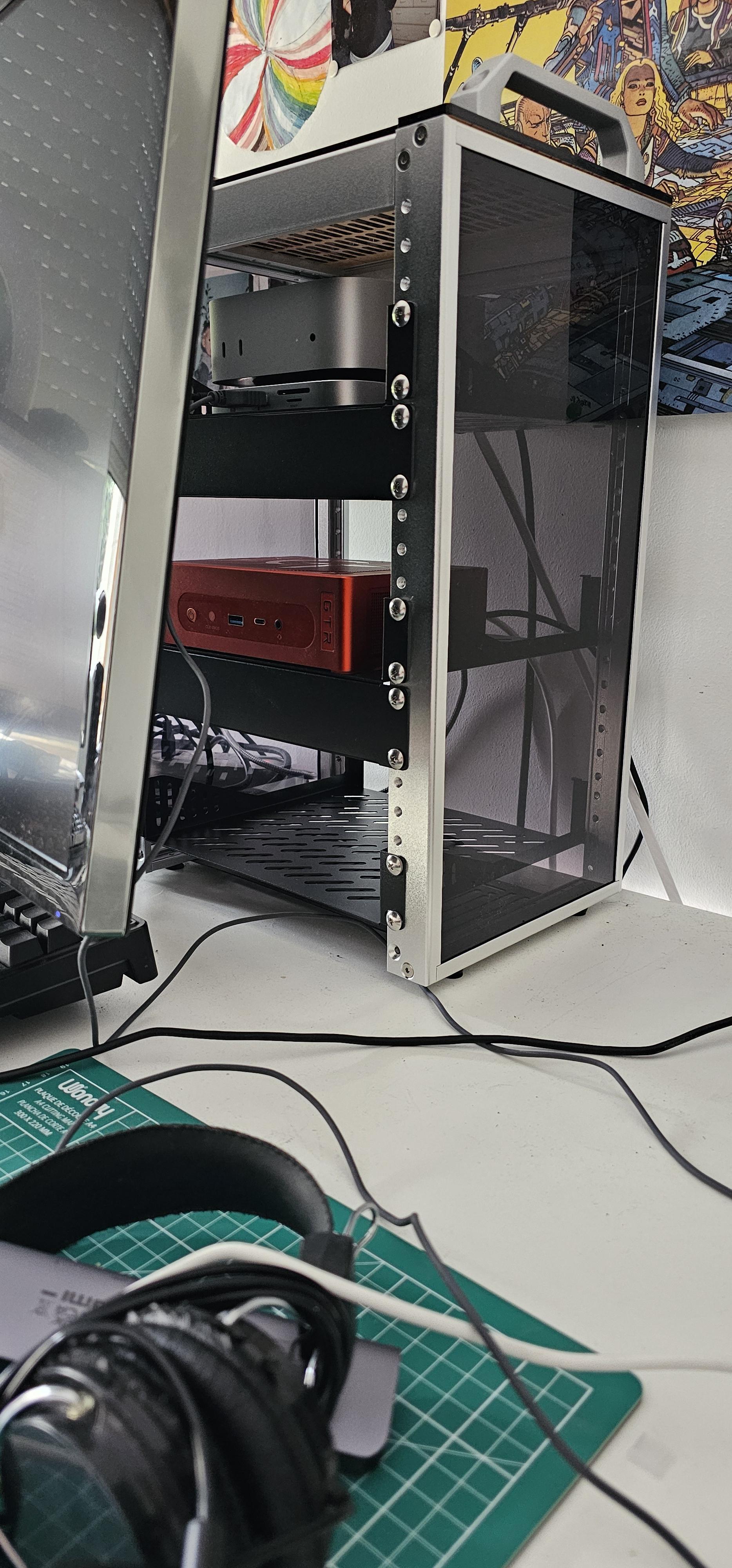 Photo of the DeskPi installed on my desk behind a monitor