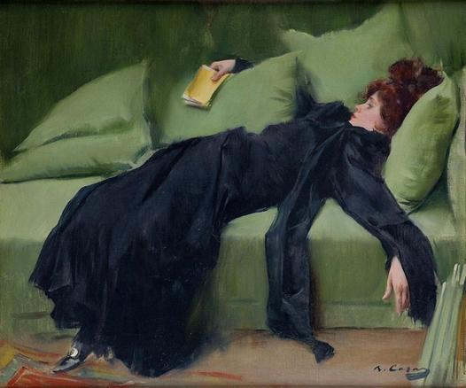1899, after a dance: young woman in fashionable black garment laying on a green sofa, exhausted, with a dancing card in her right hand. 