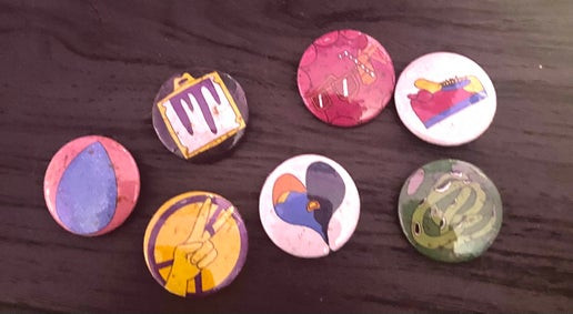 An assortment of buttons with specks of dirt on them