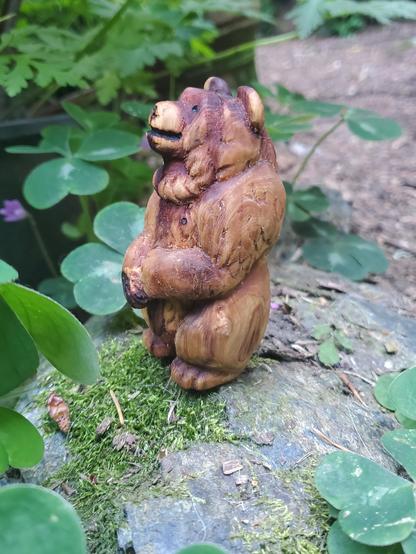 carved bear in profile facing left