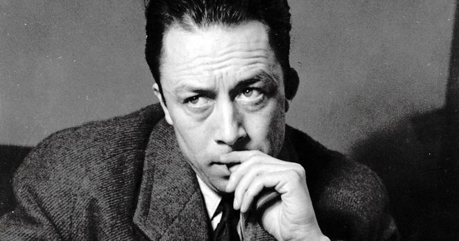 A monochrome photo of author and philosopher Albert Camus