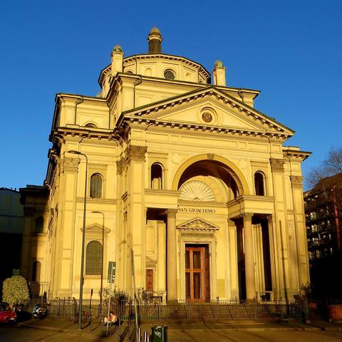 View of the main facade of a church in renaissance revival style in the evening sun.