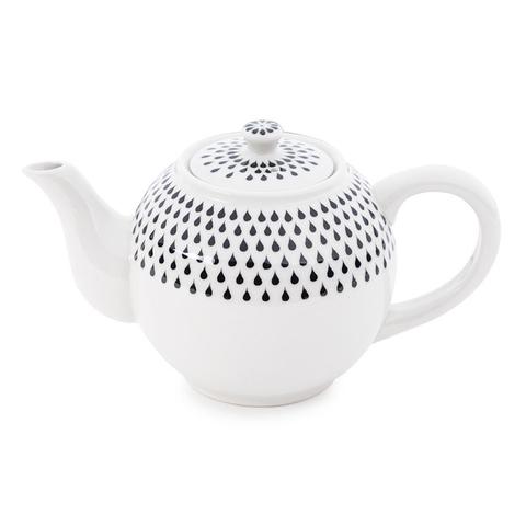 tetera blanca con dibujos de hojas
