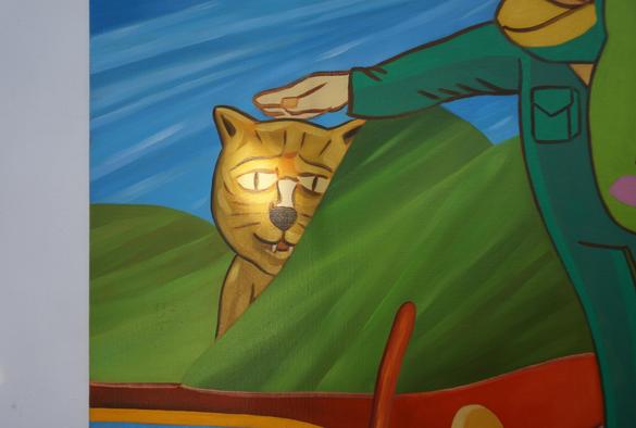Ici on peut voir le détail d'une peinture qui montre un chat dont la moustache est éclairée par un rayon de soleil le soir.