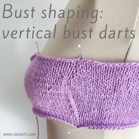 Sideways view of a mannequin with a lilac knit swatch pinned over the bust area, showing vertical darts to create more fabric in the bust area of a garment.