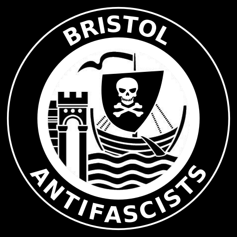 Text reads Bristol Antifascists in white on a black background in a circle. In the center is a modified version of the Bristol city council logo with a skull and cross bones on the flag.