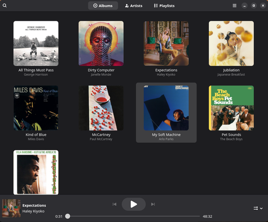 A grid of album covers nested in a music player on a desktop display. 