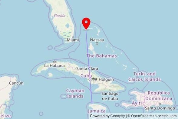 A map showing the great circle route from Montego Bay in Jamaica to a map pin at Calvary Bible Church, Seargent Major Drive, City of Freeport, Bahamas