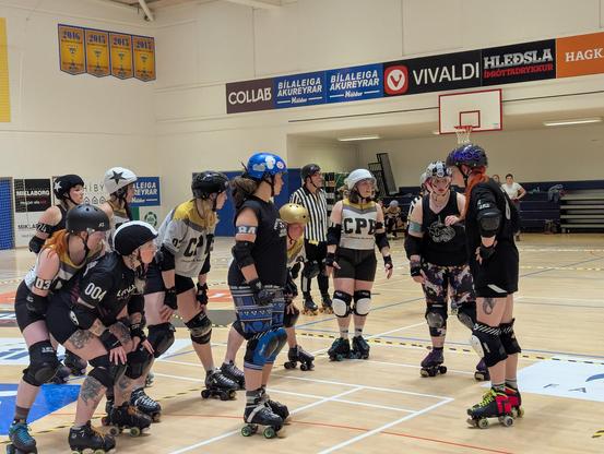 Roller Derby players getting ready for the next jam 